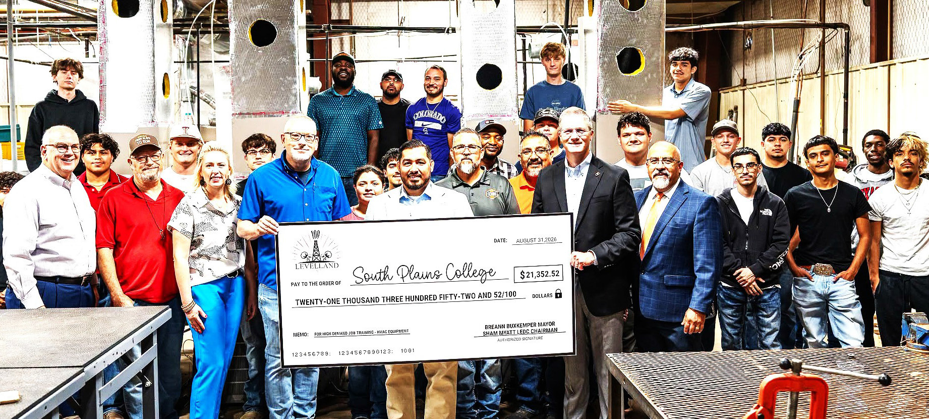 SPC HART DONATION - Representatives from the City of Levelland and the Levelland Economic Development Corporation presented a check of $21,352.52 to South Plains College President Dr. Robin Satterwhite, Technical Education Dean Albert Garcia, faculty and students in the SPC heating, air conditioning and refrigeration technology program on Aug. 31 in SPC’s HART facility on the Levelland campus. (SPC Photo)