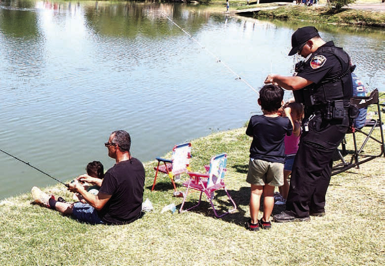 CASTING WITH COPS – Pictured are participants in Saturday’s Casting with Cops event at Lobo Lake. The second annual event featured fishing, lunch provided by the Lions Club and a chance to get to know local law enforcement. (Staff photo)