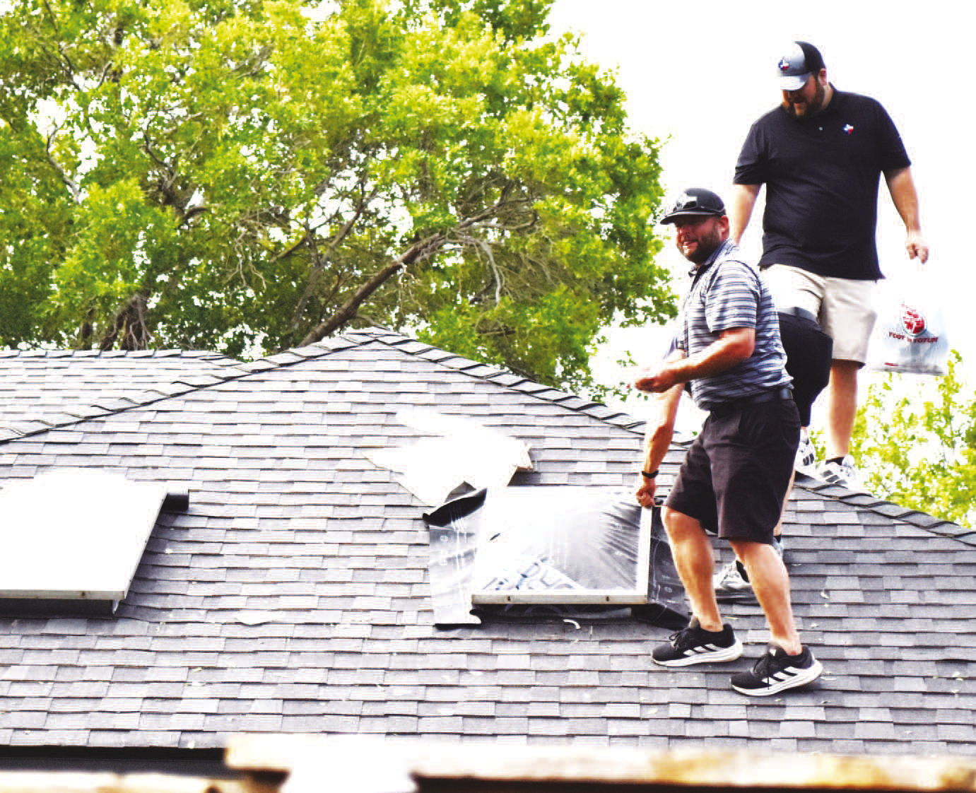 STORM SKYLIGHT REPAIR - Following the severe thunderstorm on Tuesday evening, there were numerous reports of skylights being knocked out by large hail. (staff photo by Lynda Work)