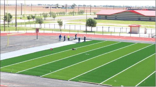 HIGH-PERFORMANCE TURF - Workers began to install the new turf onto the Levelland High School football field. The multi-step installation replaces the stadium's older playing surface with modern, high-performance turf. The new turf comes thanks to Hockley County Credit Union. (Staff photo by Trinity Bourdeaux)