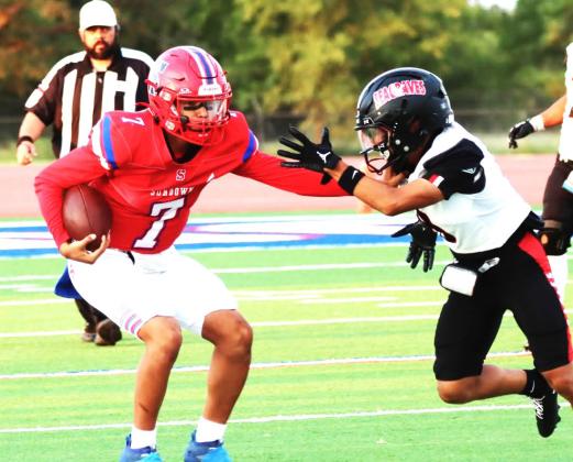 Sundown Roughneck prepares to defend ball agaisnt Seagraves defensive player. (Sundown ISD photo)