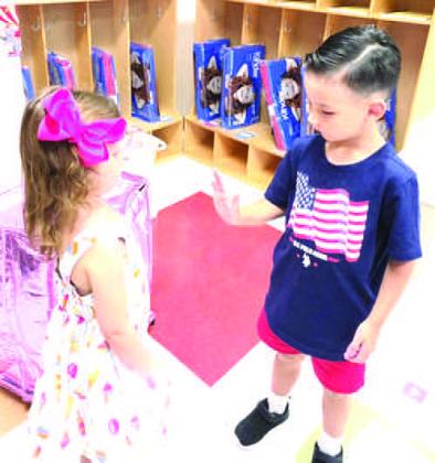 HELLO FRIEND - Two students are seen greeting each at Levelland ABC back to school night. Levelland ISD students and staff will start the new school year Wednesday, Aug. 19. (Levelland ISD)
