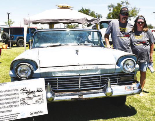 WORK IN PROGRESS – Pictured are Richard and Kim Thyfault with their 1957 Ford Fairlane Skyliner at the 20th annual Thunder on the Plains car show. The car won first place in the Project in Progress class and was featured on this year’s T-shirts, which were sponsored by the 509 Restaurant. (Staff photo by Ada Niederhauser)
