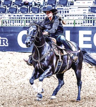 ON TO THE SECOND BARREL- SPC Sierra Telford guides her horse through the barrel racing pattern in the second preliminary round of competition. (Photo from SPC Facebook page)