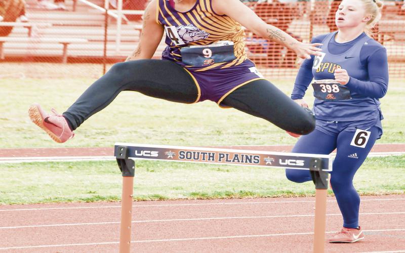 MANCIAS HURDLES - Anton Lady Dawg Alyssa Mancias clears a hurdle during her 300-meter hurdles race this past Friday at the Regional Championships at South Plains College. (Staff photo by Jentezen Smith)
