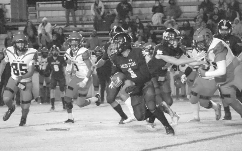 CANT CATCH ME - Morton quarterback Dante Chavez escaped the pocket from the Seagraves pass rush this Thursday night for the teams last district game before playoffs. (Staff photo by Aalijah Soliz)