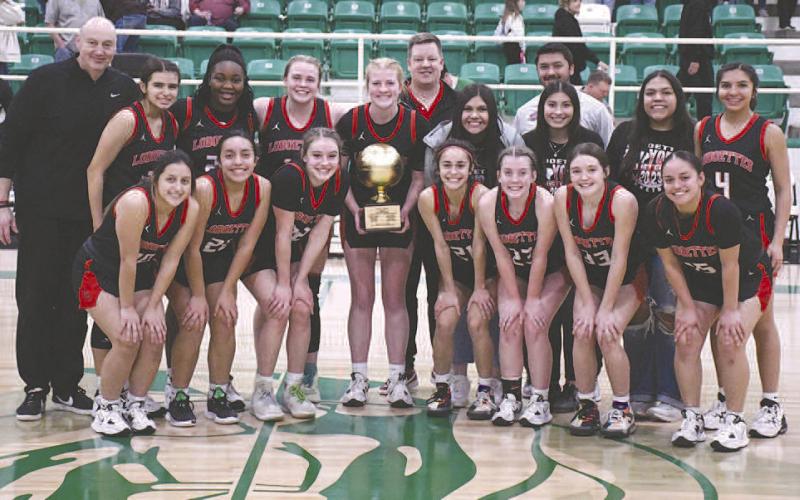 AREA WIN- The sixth ranked Levelland Loboettes eliminated the Bridgeport Sisses, 44-18, in Hamlin Friday evening to become the 4A Region 1 Area Champions. Back row L-R: Barnett, Leilani, Destinyii,Laci, Ellie, Coach Nathan Riggan, Marleah, manager Cathy Luna, Coach Marc Rios-Elbert, trainer Cecilia Berumen and Mia Morin. Front row L-R: Adrenna Galvan, Olivia Velardez, Emery Smith, Carly Tienda, Madison Stafford, Presley Smith and Angelica Gonzales. (Staff Photo by Dom Puente)
