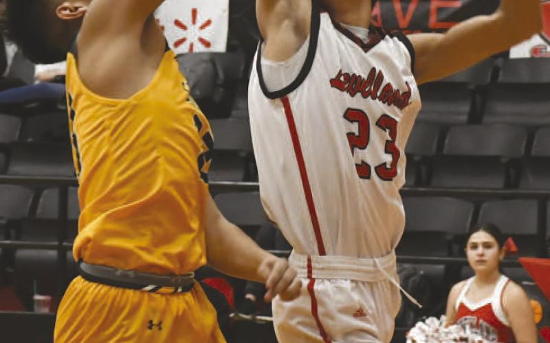 GLASS WORK- Zameron Lecroy battled for a rebound in a 47-37 Levelland Lobo home loss to the Seminole Indians last Friday in UIL high school boys’ basketball action. Lecroy had seven points in the effort. The Lobos will host Sweetwater at 7:30 p.m. on Friday. (Photo by Jay Kelley.)