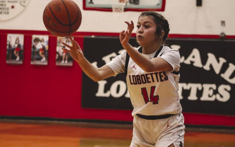 PASS - Levelland Loboette Kaylee Penner passed the ball to her teammates during the team’s win last Tuesday night against the Sweetwater Lady Mustangs. (Staff photo by Aalijah Soliz)