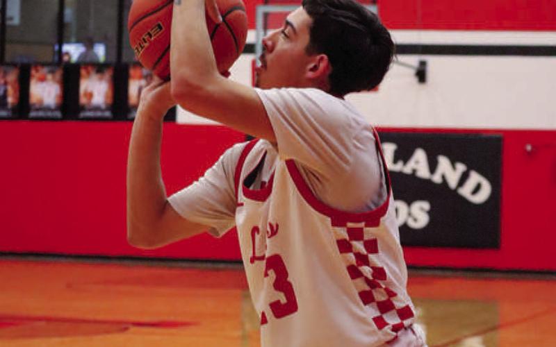 THREE - Levelland Lobo Ozzie Solano shot the ball during the team’s contest against the Sweetwater Mustangs last Tuesday at home. (Staff photo by Aalijah Soliz)