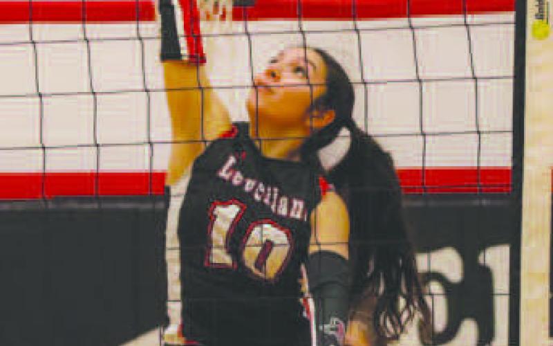 TIP OVER - Loboette Mia Morin tipped the ball over the net in the team’s contest against Littlefield this past Tuesday night. (Staff photo by Aalijah Soliz)