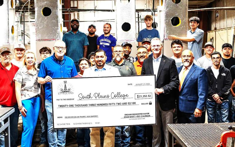 SPC HART DONATION - Representatives from the City of Levelland and the Levelland Economic Development Corporation presented a check of $21,352.52 to South Plains College President Dr. Robin Satterwhite, Technical Education Dean Albert Garcia, faculty and students in the SPC heating, air conditioning and refrigeration technology program on Aug. 31 in SPC’s HART facility on the Levelland campus. (SPC Photo)