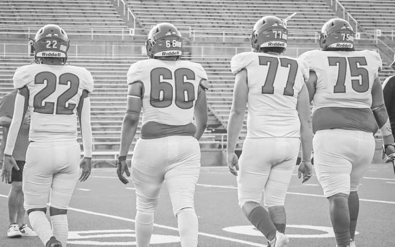 TEAM CAPTAINS - Sundown Roughnecks Isaac Lopez, Zack Gonzales, Hunter Clark and Jesus Rodriguez walked to the center of the field for the coin toss last Thursday in Canyon for the team’s season opener against the Shamrock Fighting Irish. (Staff photo by Aalijah Soliz)