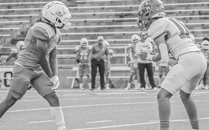 PRESS - Sundown Roughneck Marcus Solis played press coverage against the Shamrock receiver last Thursday during the team’s season opener in Canyon. (Staff photo by Aalijah Soliz)