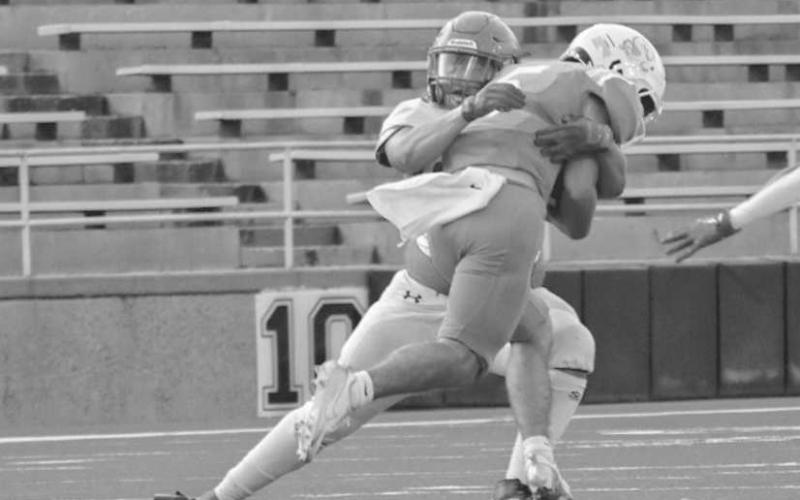 GOING NOWHERE - Sundown Roughneck Zack Gonzales wrapped up the ballcarrier in the open field last Thursday during the team’s season opener in Canyon. (Staff photo by Aalijah Soliz)