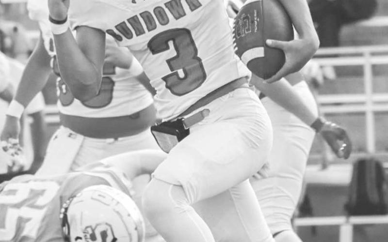 ON THE MOVE - Sundown Roughneck Coen Nevarez ran the ball to the left side of the field during the team’s season opener in Canyon against the Shamrock Fighting Irish. (Staff photo by Aalijah Soliz)