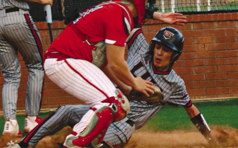 SAFE - Levelland Lobo Charlie Romo slid to home plate to earn the team a point during the team’s game against the Sweetwater Mustangs last Friday at home. (Staff photo by Aalijah Soliz)