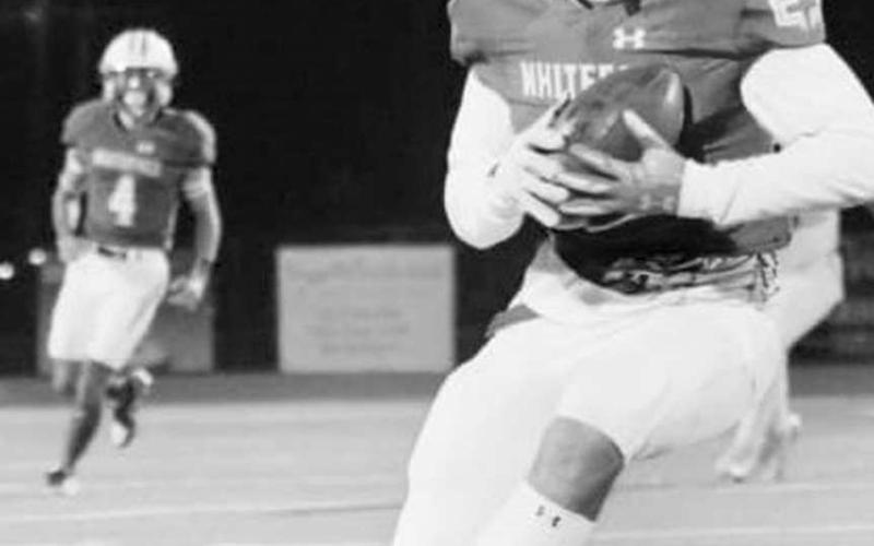 RUN AFTER CATCH - Axel Rivera caught the only pass of the night from Jeremiah Rendon (#4) for the Whiteface Antelopes on Nov. 22. It was good enough for a touchdown in a 66-16 Whiteface win over the Booker Kiowas in UIL Class 1A-1 high school six-man football area round action in Tulia. The Antelopes will be in Lockney tonight, facing Borden County in the quarterfinal round at 6 p.m. (Photo by Holly Crutcher)