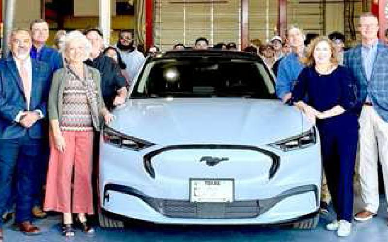 MUSTANG DONATION-- Smith Auto Family presents a 2023 Ford Mustang Mach-E to South Plains College leadership and automotive students on Sept. 24 on the Levelland campus. The SPC automotive service technology program will use the Mustang to teach students about the theory of electric vehicles and offer hands-on training in advanced automotive technologies. (SPC Photo)