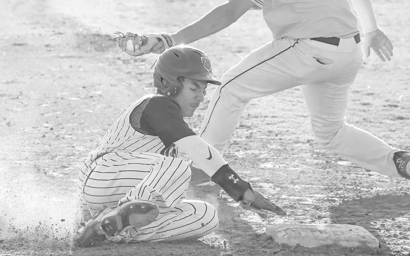 UNDER THE TAG- The Levelland Lobos fell behind early and could not come back in a 9-5 home loss to Snyder last Friday. Lobo base runner Noah Tienda slid into third under a tag attempt by the Tiger’s third baseman.