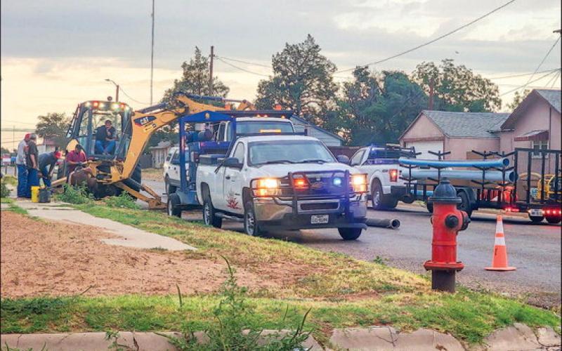 WATER LINE WORK - A crew of workers with the City of Levelland were spending their Monday evening working on digging to the necessary water line. The crew was working in front of a residence located on West Avenue and 8th Street. Through traffic on West Avenue was blocked for a period of time requiring vehicles to adjust their routes. (Staff photo by Dom Puente)