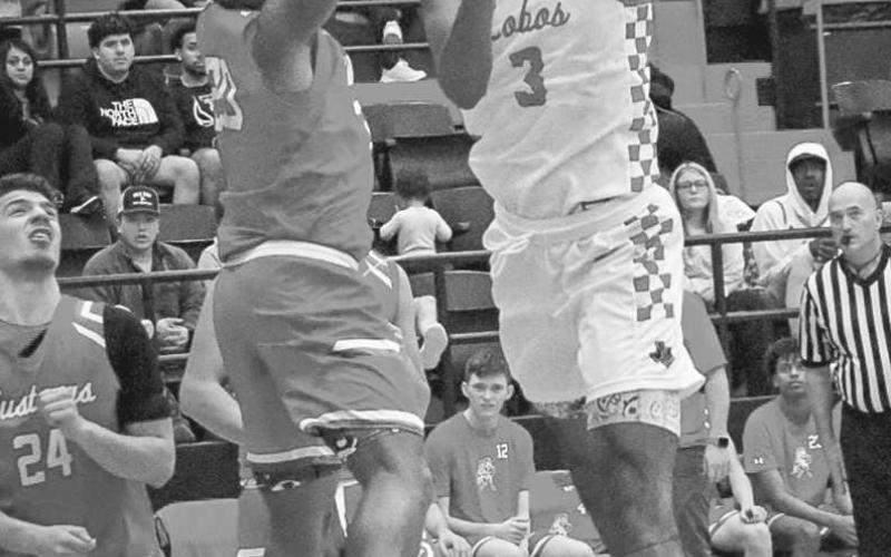 ACROBAT - Levelland Lobo Eryk Jones made a reverse layup during their contest last Tuesday against the Sweetwater Mustangs at home. (Staff photo by Aalijah Soliz)