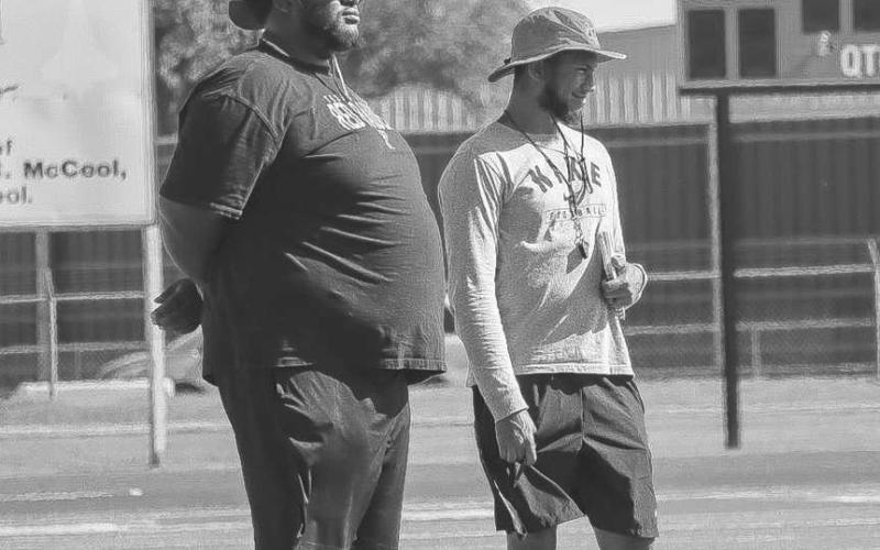 COACHING - Head Football Coach and Athletic Director Lyle Leong and Assistant Keith Dixon watched their team compete against Estacado and Coronado this Monday in Lubbock in 7 on 7. Coach Leong was also named Dave Campbell’s top 40 under 40 coaches in Texas. (Staff photo by Aalijah Soliz)