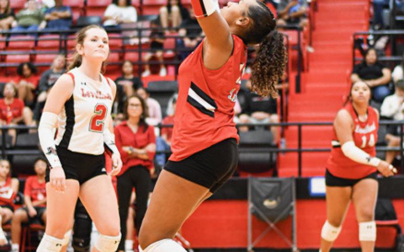 SET EM’ UP – Freshman London Branch passes the volleyball to set her Levelland teammates up on the play during a match against SA Lakeview this past Tuesday. The Loboettes would go on to sweep them 2519, 30-28 and 26-24.