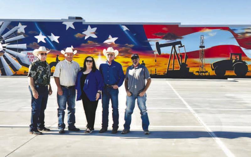 MURAL FOR THE COMMUNITY - The parking lot project was recently completed with Muralist Alfonso Garcia of Tulia completing his mural on the wall facing the lot. The parking lot is located across the Hockley County Annex at the corner of Austin Street and Avenue H. Pictured from left to right are: Commissioner Tommy Clevenger, Commissioner Alan Wisdom, Hockley County Judge Sharla Baldridge, Commissioner Larry Carter and Commissioner Seth Graf. (Photo courtesy of Kelli Martin)