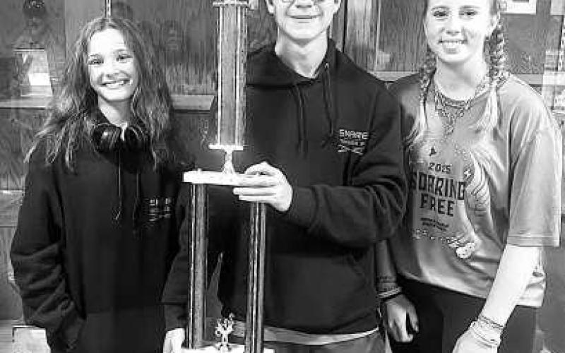 Ropes band director is Nora Brazil. Ropes High School band students Millie Sisson, Tanner Fair and Kyleigh Becton, members of the drumline and front ensemble show off the trophy after competing for their first time at the West Texas Auxiliary Championships (WTAC) where the band won first place for the 2A division.