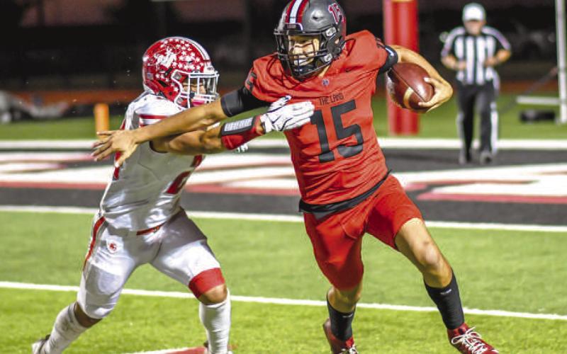 EVASIVE - Levelland Lobo Ethan Salazar ran out of an arm tackle from the Perryton Rangers this past Friday at home during the team’s district game. (Staff photo by Dom Puente)