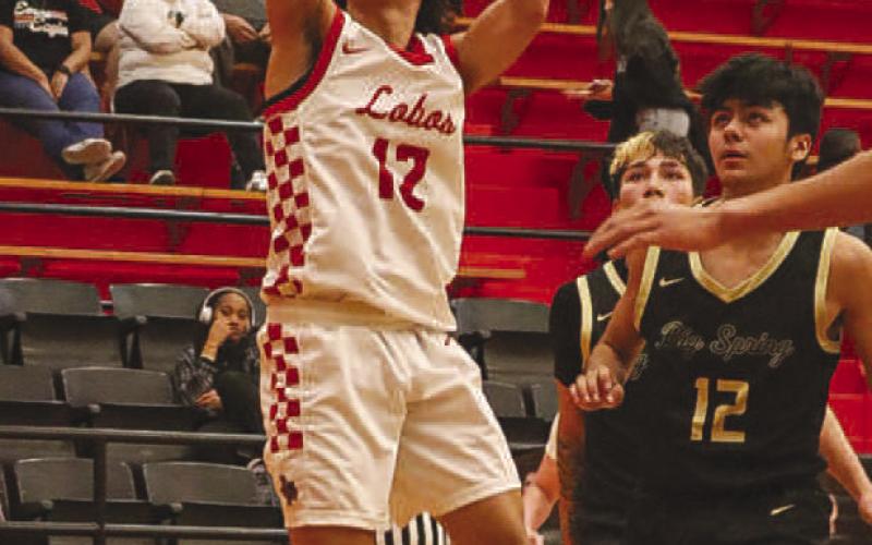 WIDE OPEN - Levelland Lobo Nehemiah Sanchez layed the ball up, getting wide open under the basket during their game against Big Spring. (Staff photo by Aalijah Soliz)