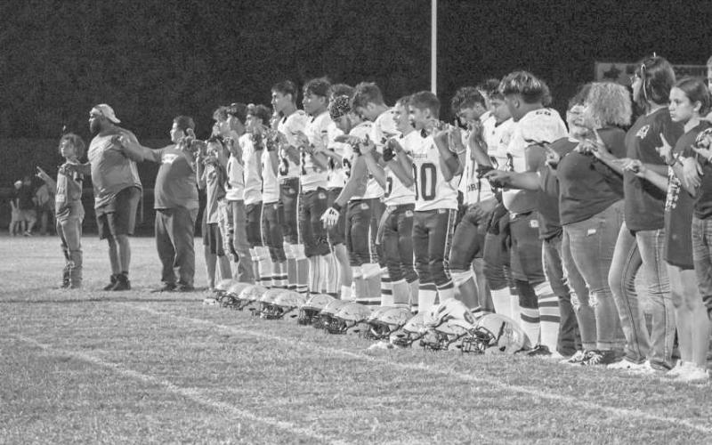 SCHOOLSONG - The Anton Bulldogs lined up for their school song after their win against the Chillicothe Eagles this past Thursday in Motley County. (Staff photo by Aalijah Soliz)
