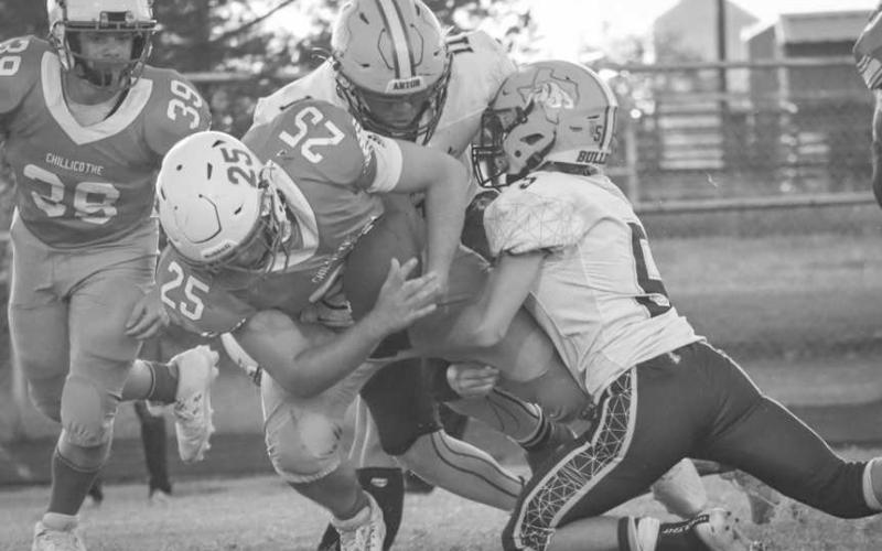 DOWN YOU GO - Anton Bulldogs Jose Avalos and Lano Castillo tackled the Chillicothe ballcarrier this past Thursday in Motley County. (Staff photo by Aalijah Soliz)