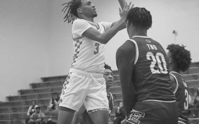 VERTICAL - Levelland Lobo Eryk Jones rose above the Estacado defense for the tough bucket during the team’s game last Tuesday night. (Staff photo by Aalijah Soliz)