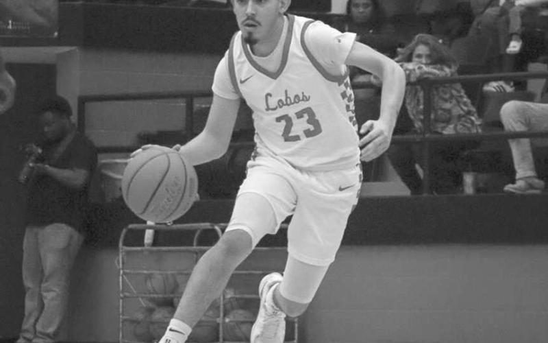 TOO FAST - Levelland Lobo Ozzie Solano brought the ball down the court during the team’s game against Estacado this past Tuesday night at home. (Staff photo by Aalijah Soliz)