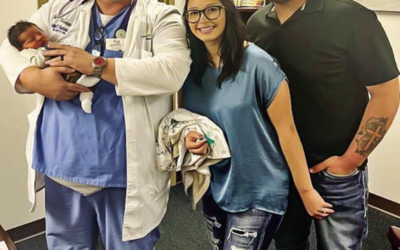 FULL CIRCLE - Pictured is Dr. John Hanna holding Jaxon McCoy, the 4,000 delivery of Hanna’s career. To the right of Dr. Hanna is mother Summer Hernandez and father Josh McCoy, who were both delivered by Dr. Hanna. Jaxon was born March 31, weighing in at seven pounds and was 19 inches tall. (Photo courtesy of Levelland Covenant Hospital)