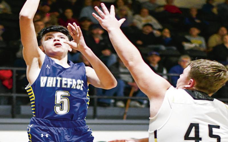 GANDARA GOIN’ UP - Whiteface’s Ivaniel Gandara goes up with a floater while Morton’s Britton Boggs guards him during their basketball game at Morton High School this past Tuesday. (Staff photo by Jentezen Smith)