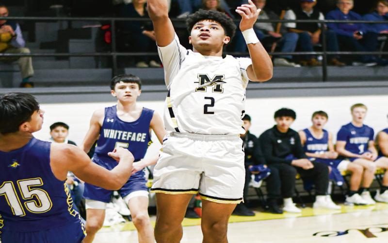 FLOATER GAME - Morton’s Brayden Villarreal evades the Whiteface defenders and shoots a floater during their basketball game this past Tuesday at Morton High School. (Staff photo by Jentezen Smith)