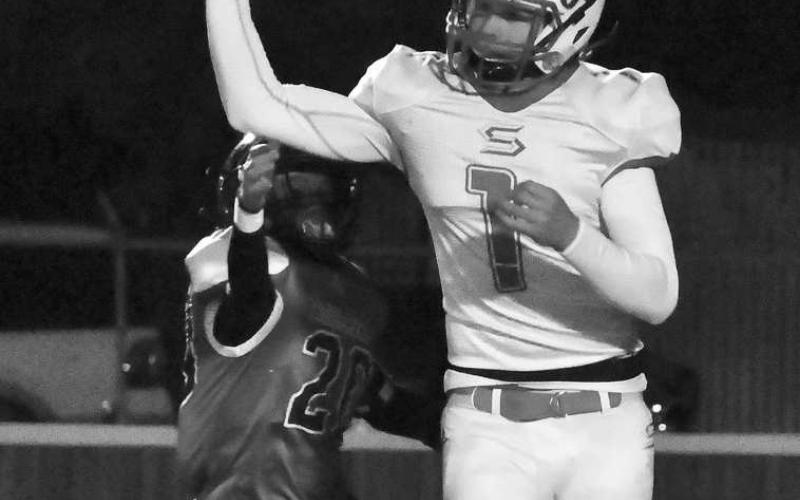 PASS RUSH- Rayden Potter and the rest of the Whitharral defensive unit put pressure on Silverton’s backfield all night in a 46-0 shellacking in UIL Class 1A-2 Bi-District high school football action last Friday in Lockney. (Photo by Jay Kelley)