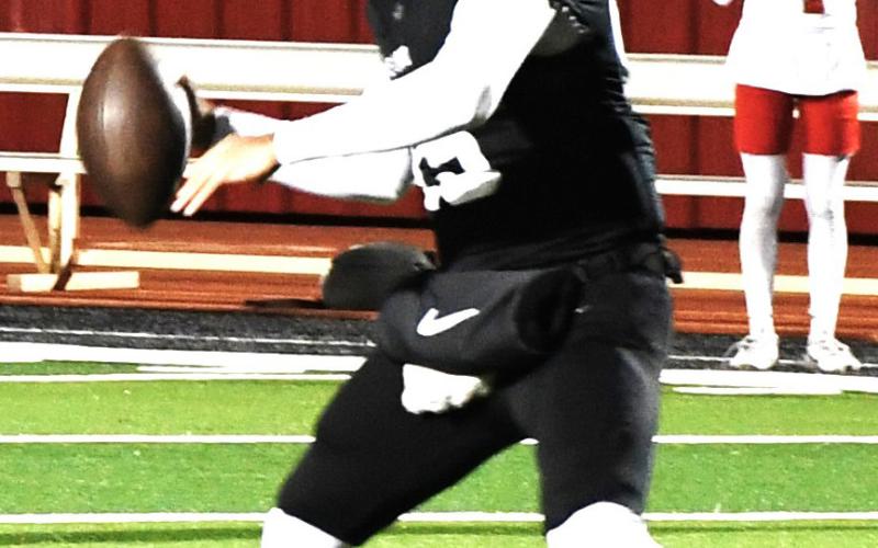 (right) Ethan Salazar prepares to throw the ball for the Levelland Lobos versus Perryton on Oct. 16 in the 76-53 win.