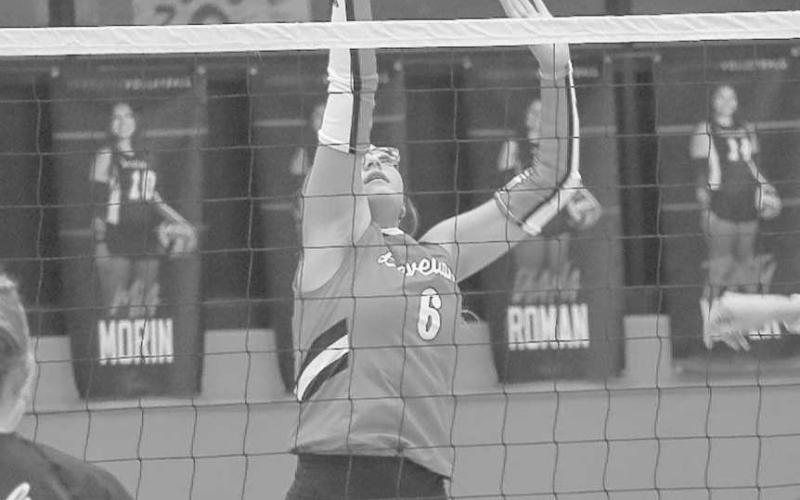 SOFT TOUCH - Levelland Loboette Hailiee Estrada tapped the ball over the net to throw the Cowgirls defense off during their last matchup this past Tuesday at home. (Staff photo by Aalijah Soliz)