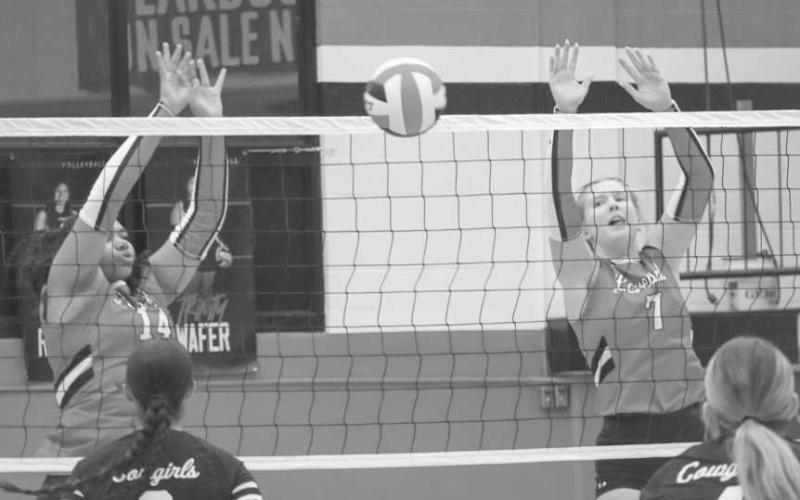 BLOCKED - Levelland Loboettes Trinity Wafers and Addisen Campbell jumped up to block the Plains Cowgirls shot this past Tuesday at home for their regular season matchup. (Staff photo by Aalijah Soliz)