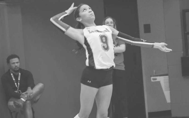 OVER THE NET - Levelland Loboette Aubree Gaona hit the ball over the net this past Tuesday against the Plains Cowgirls at home. (Staff photo by Aalijah Soliz)