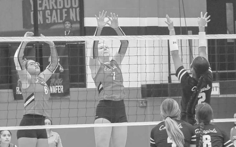 NOTAROUND HERE - Levelland Loboettes Hailiee Estrada and Addisen Campbell got vertical to block the shot from the Plains player this past Tuesday at home. (Staff photo by Aalijah Soliz)