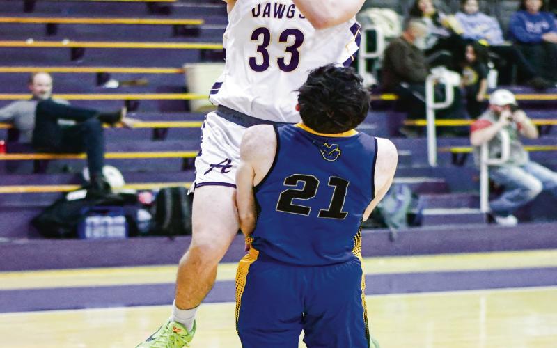 CARLOCK PUTS IT UP - Anton Bulldog Caleb Carlock puts up a shot during their game against Wellman Union this past Friday night at Anton High School. (Staff photo by Jentezen Smith)