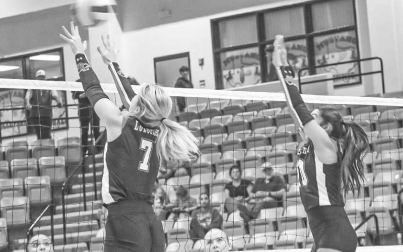 VERTICAL - Levelland Loboettes Addisen Campbell and Mia Morin jumped up to block the shot this past Tuesday in Andrews against the Lady Mustangs. (Staff photo by Aalijah Soliz)
