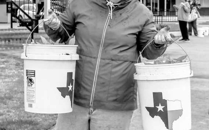 PLANT HAPPINESS - Jolenna Carter was all smiles helping plant flowers in downtown Levelland for Main Streets Community Planting Day this past Saturday. (Staff photo by Hannah Woodrum)