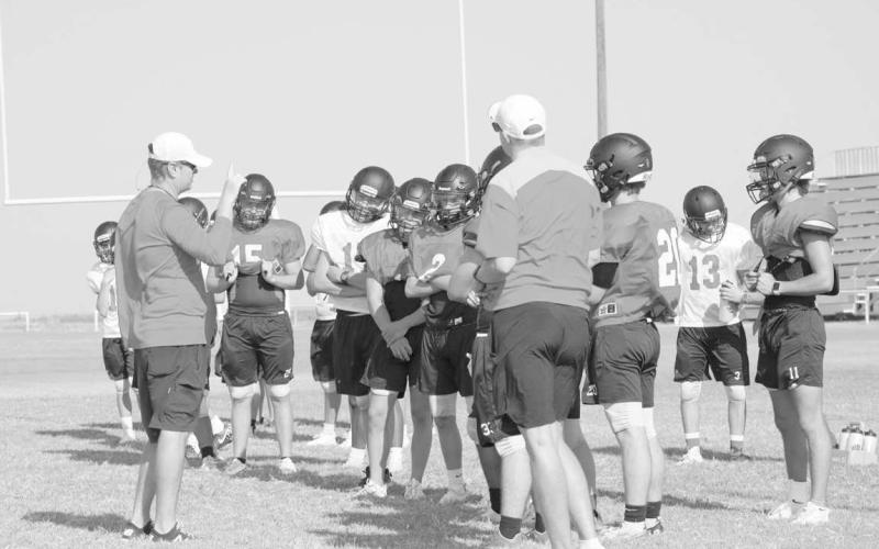 TEAM HUDDLE - The Whitharral Panthers had a team meeting to go over what the coaches expect and what to do in the next drill during two-a-day pracitces. (Staff photo by Aalijah Soliz)