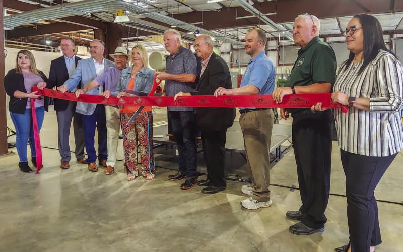 TOP-NOTCH FACILITY - South Plains College held a ribbon cutting ceremony to celebrate the completion of the welding expansion on the Levelland campus. Pictured from left to right are: Stephanie Rodriguez, SPC President Robbin Satterwhite, Board of Regent members Chris Edens and Joe Tubb, Melanie and Jody Brooks, Board of Regents Chairman Mike Box, Board of Regent members Ty Gregory and Jim Mara and Janie Mireles. (Staff photo by Dom Puente)